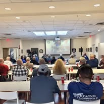 Transmission professionals gathered in a classroom for a technical presentation